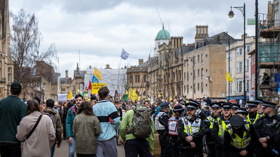 a group of police officers standing in front of a crowd of people