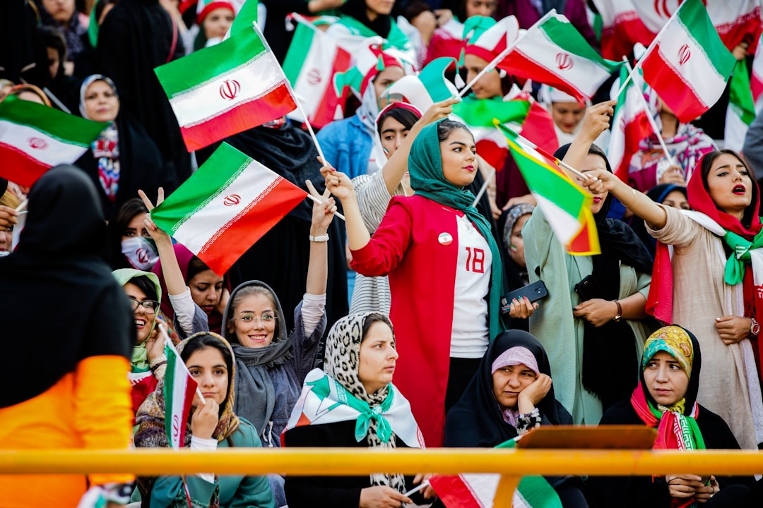 crowd of people holding mini flags