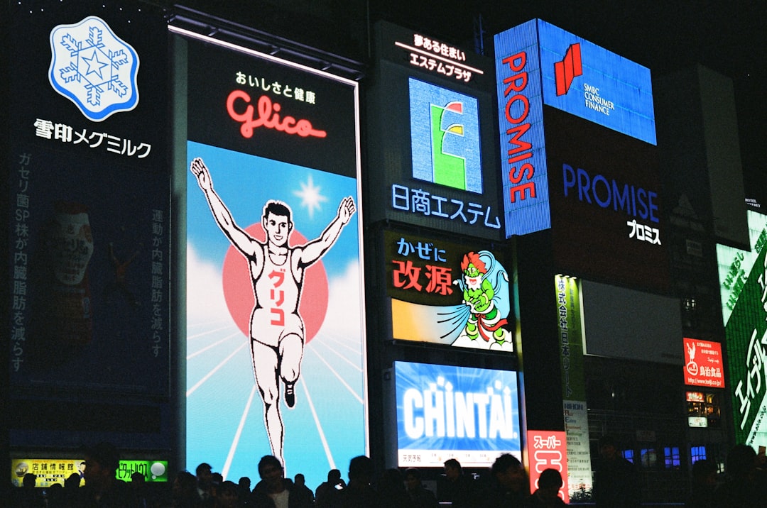 Nighttime cityscape with illuminated advertising billboards