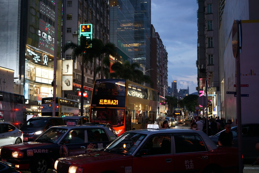 Busy city street with traffic and buildings at dusk