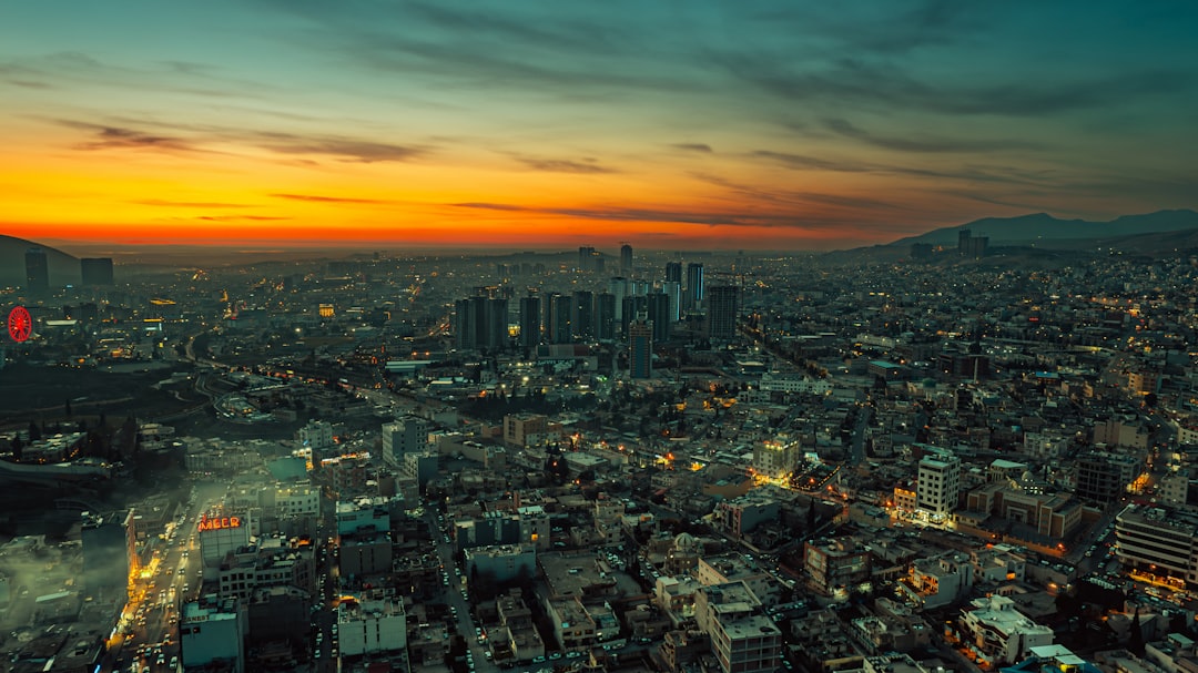 An aerial view of a city at sunset