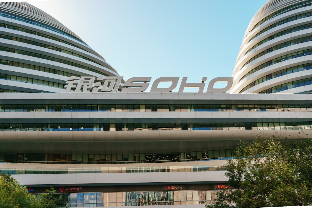 A picture of a large building with a sign on top of it