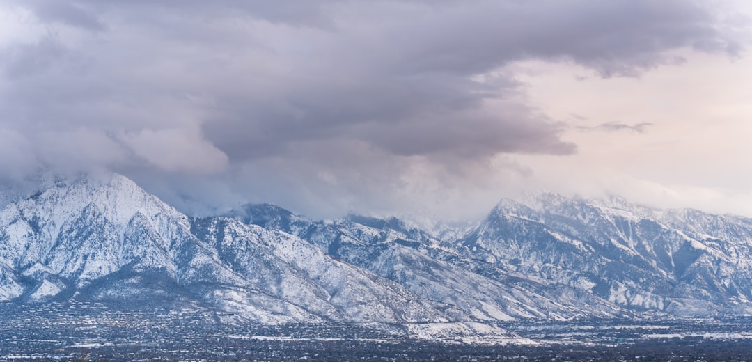 Snow-capped mountains under overcast skies.