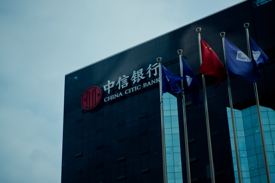 red white and blue flag on black concrete building during daytime