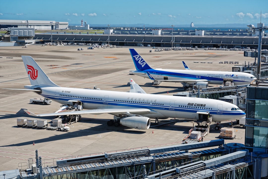 A couple of airplanes that are on a runway