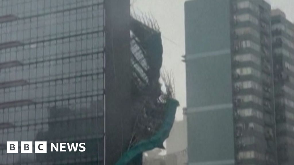 Typhoon Noul rips scaffolding from Hong Kong building