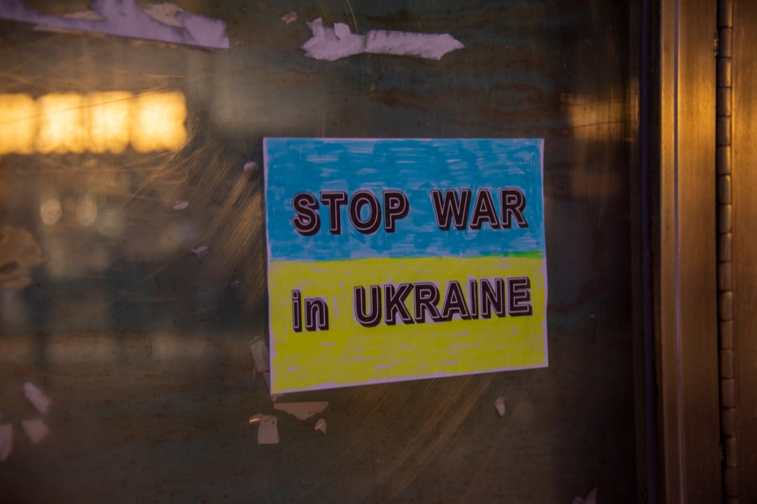 a sign on a door that says stop war in ukraine