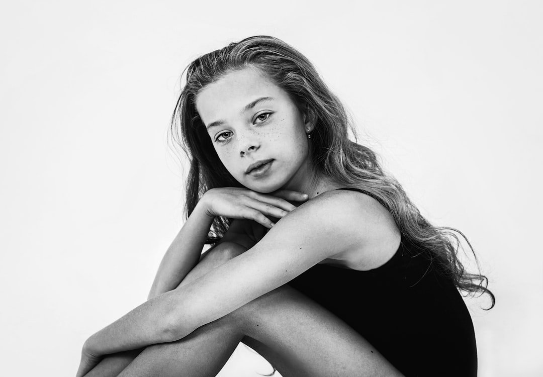 a black and white photo of a young woman
