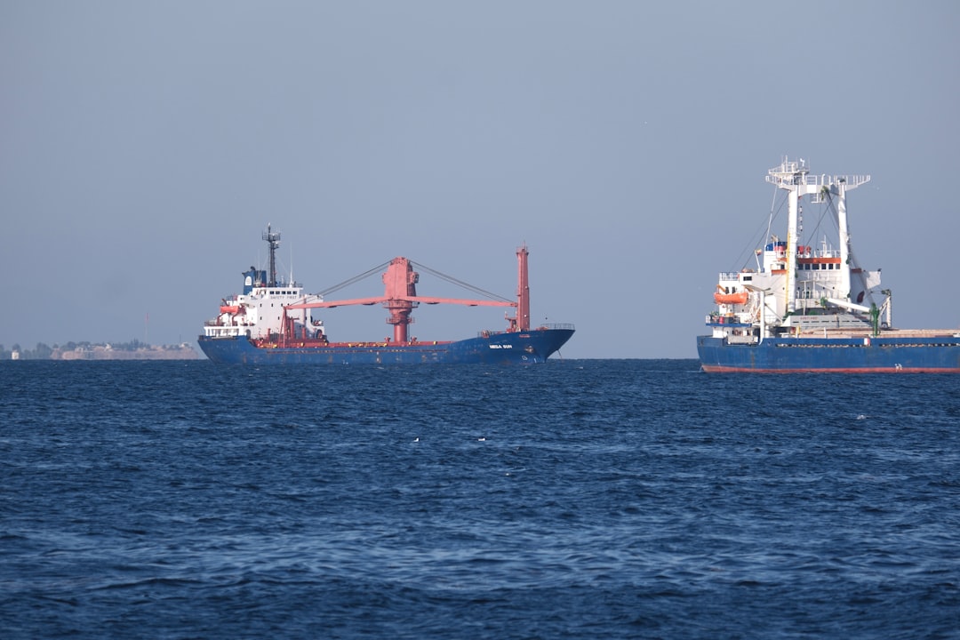 A large boat and a smaller boat in the ocean