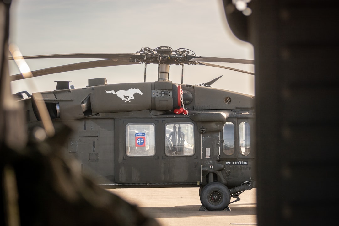 A helicopter sitting on top of an airport tarmac