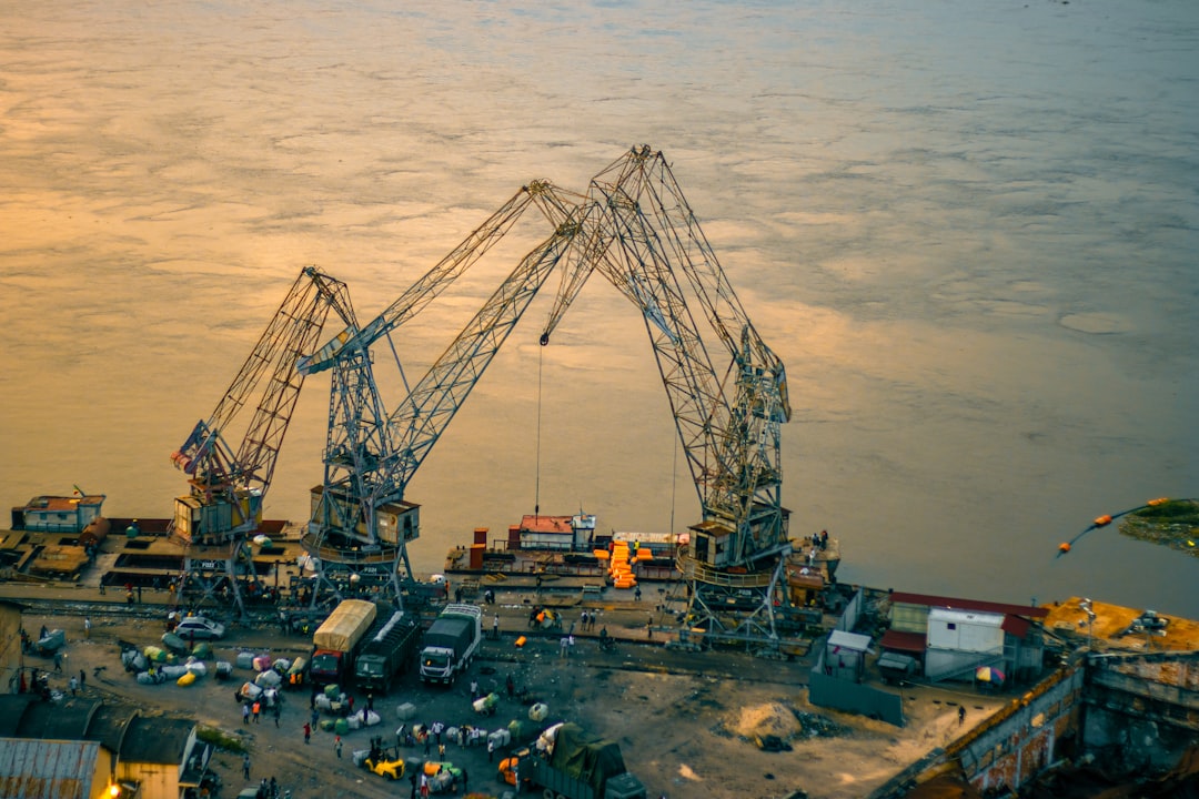 A large crane sitting on top of a body of water
