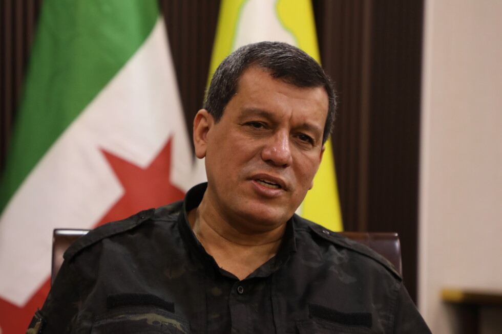 Kurdish-led group in Syria dissolves after merging with army