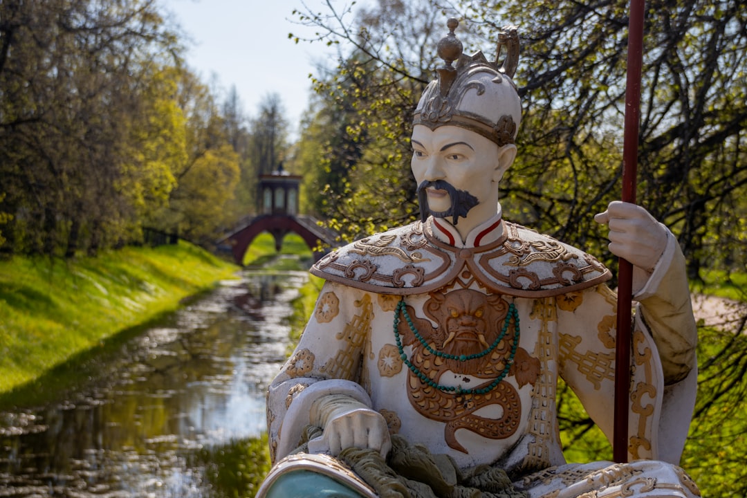 Statue of a chinese warrior in a garden