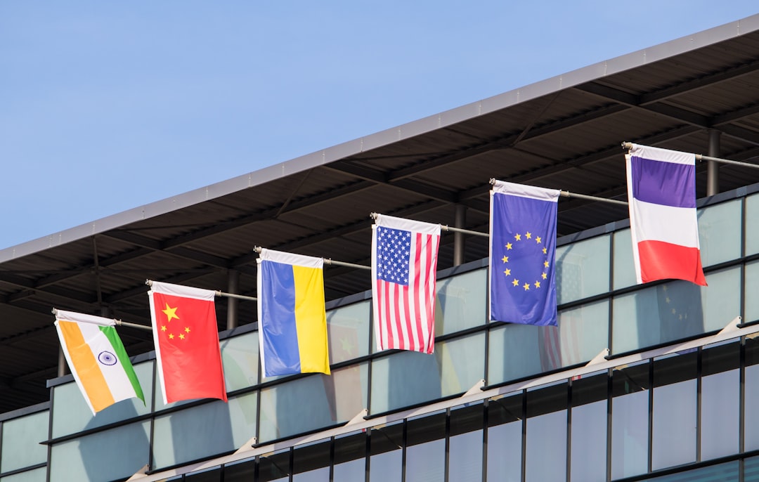 Flags of various nations fly on building