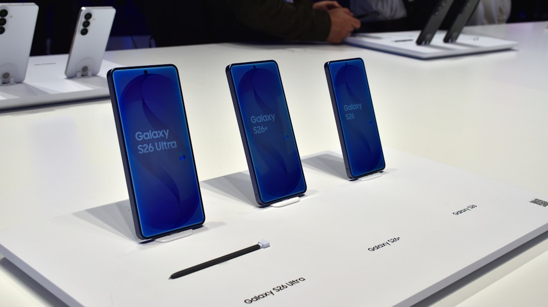 Three samsung galaxy smartphones displayed on a white surface