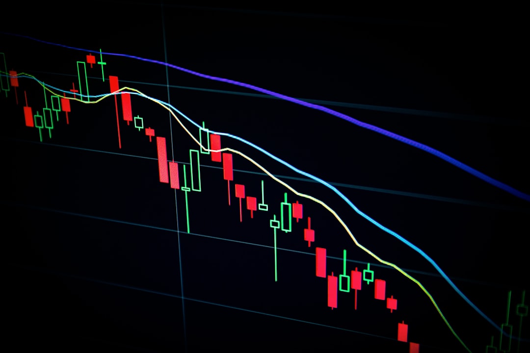 stock market candlestick chart on dark screen