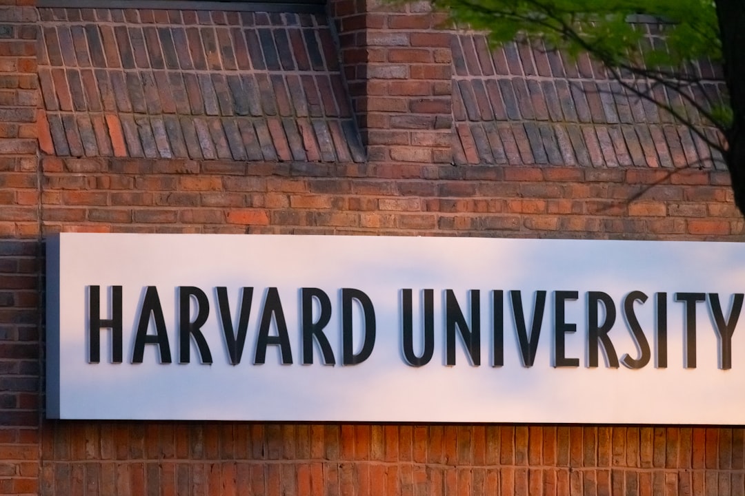 a sign on a brick wall that says harvard university