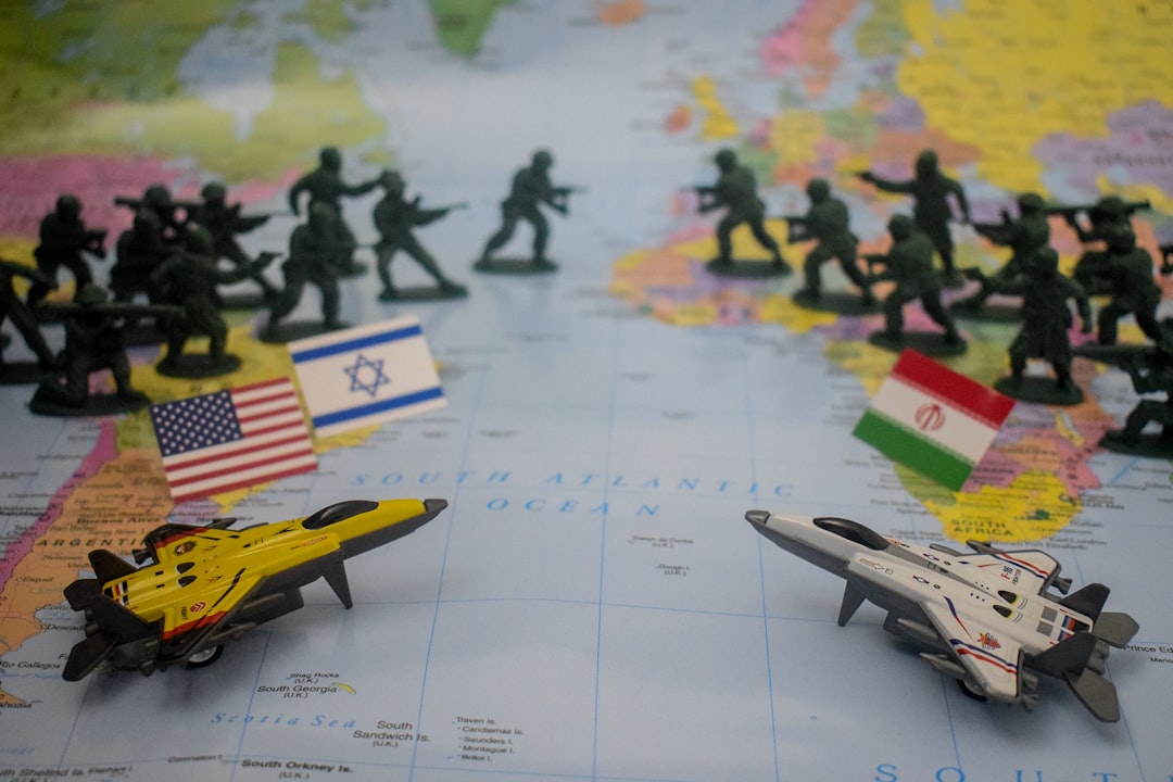 Toy soldiers and jets arranged on a world map