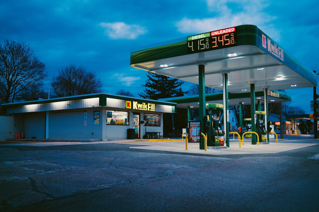 A gas station sits under the night sky