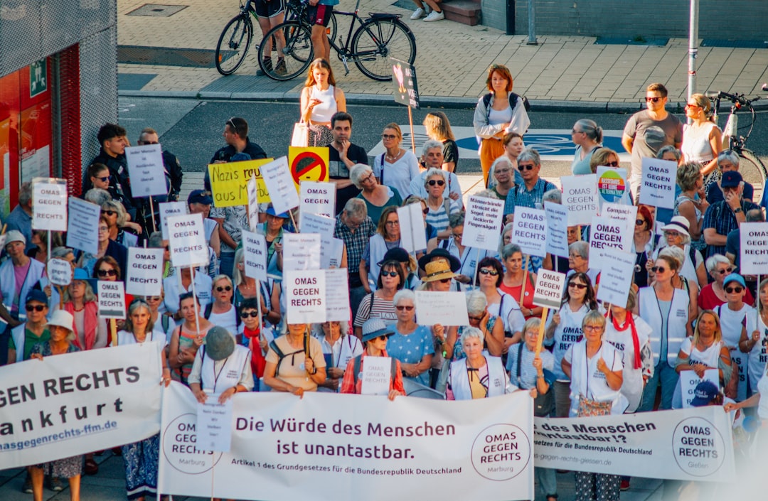 A large group of people holding up signs