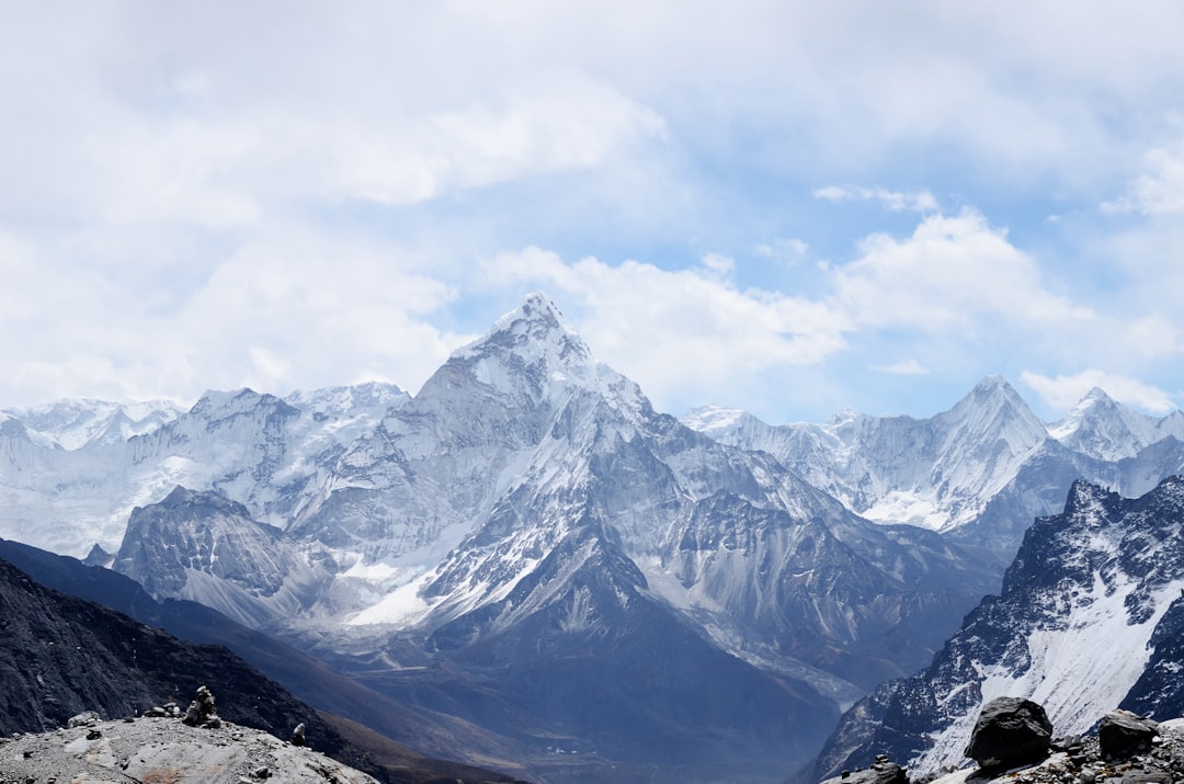 The snow-covered peak of Ama Dablam rising above a mountain range in Nepal