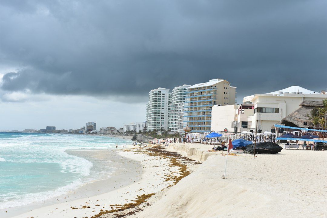 a beach with buildings along it