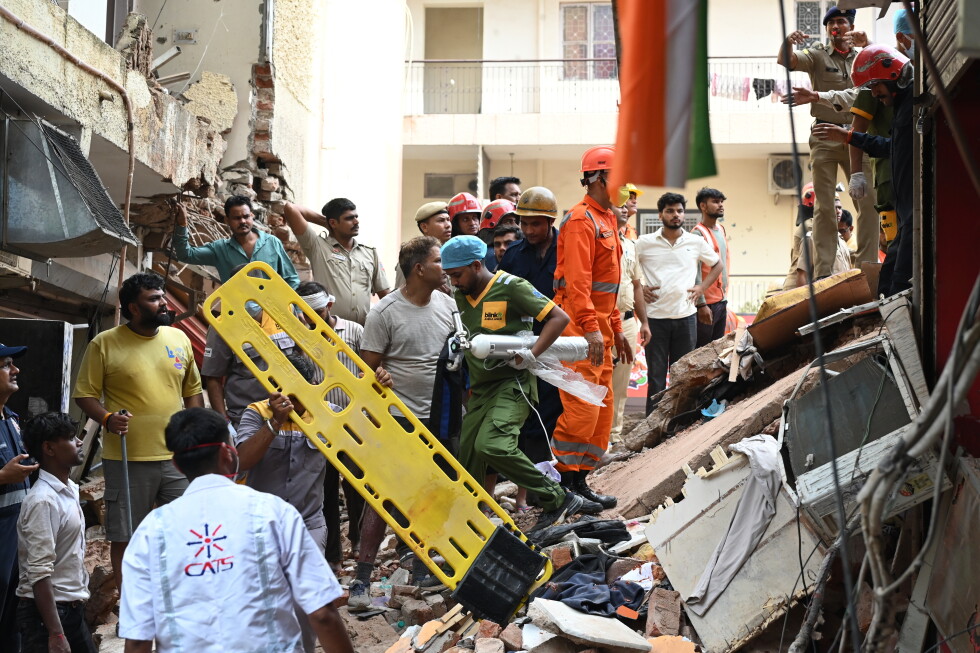 Building collapse in New Delhi kills 1, traps dozens