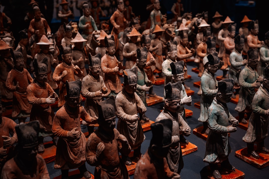 Many ancient terracotta warrior figures stand in formation