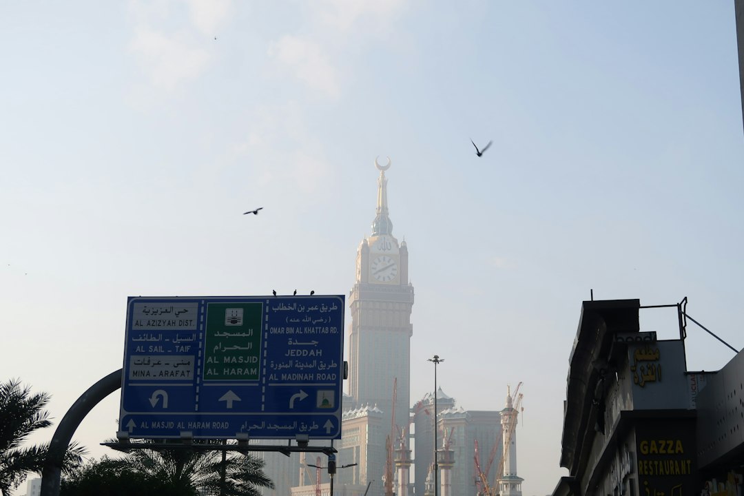 A city street with a clock tower in the background
