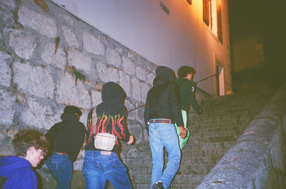 A group of people climbing up a set of stairs