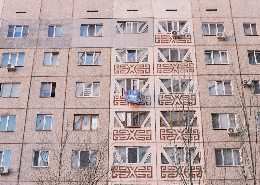 Apartment building facade with many windows and balconies