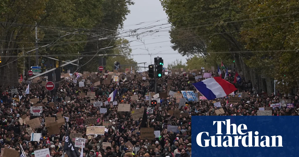 Hundreds of thousands march across France in protests over schools and policing