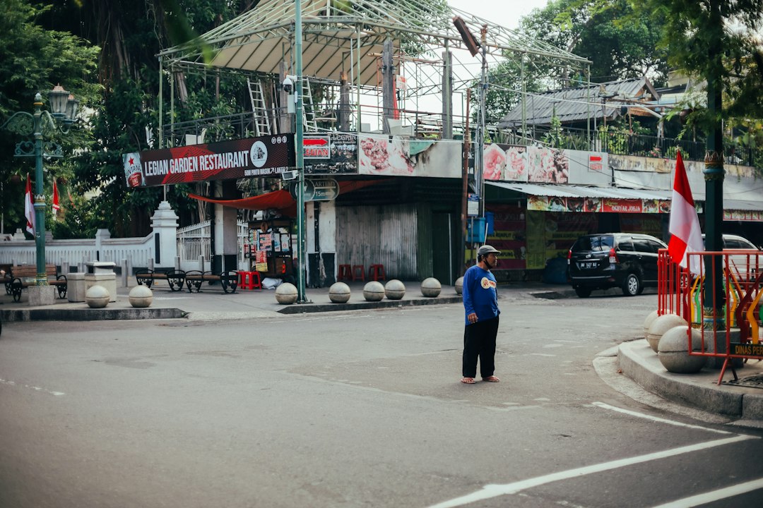 a man standing in the middle of a street