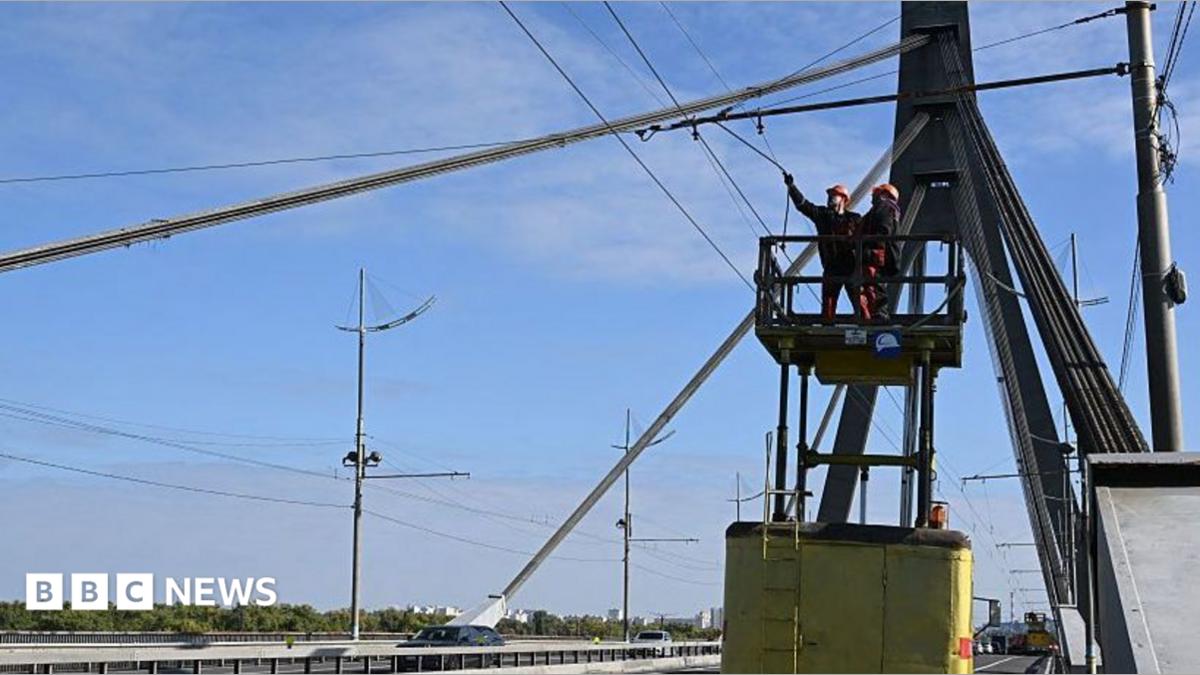 Kyiv bridge hit in drone attack as German chancellor visits