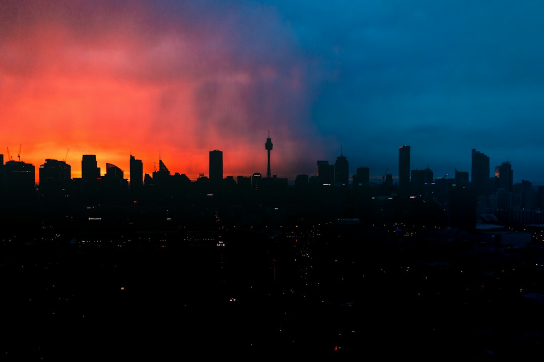 a view of a city skyline at sunset