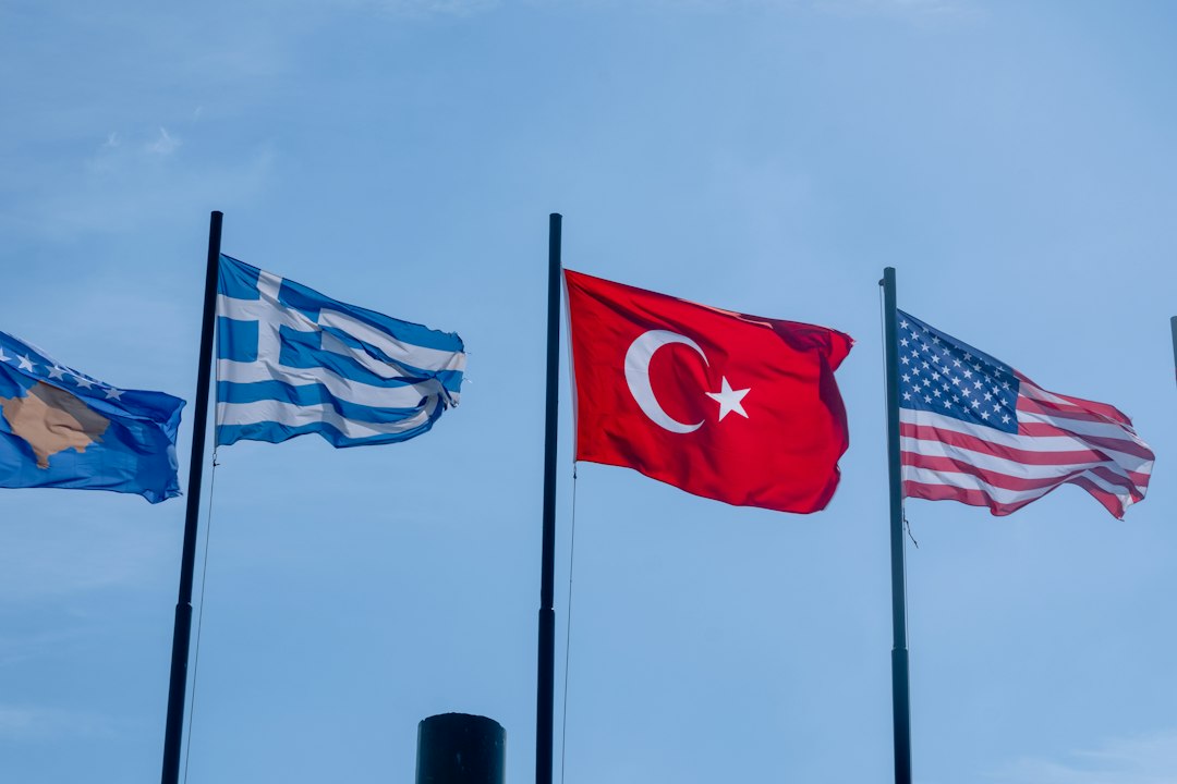 Flags of kosovo, greece, turkey, and usa waving